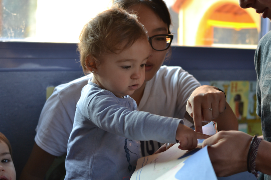 UW student Jinnie Yi works with a toddler at one of the participating infant education centers in Madrid